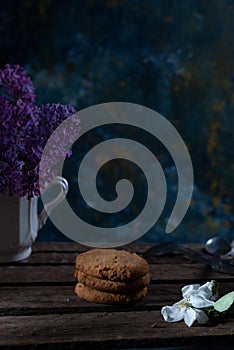 cookies still life in a rustic style on an abstract background, with spring flowers