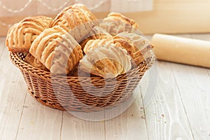 Cookies and sweet pastries with cross wired lines in basket