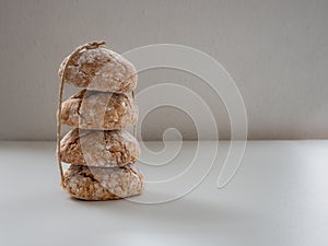 Cookies tied with a string on light background