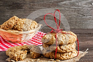 Cookies for Valentine`s Day with red heart shaped ribbon