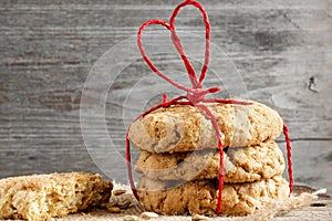 Cookies for Valentine`s Day with red heart shaped ribbon