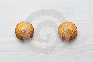Cookies on a white background, similar to female nipples. Sexy nipples in the form of cookies. Humor, double meaning