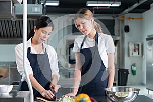 Cooking apprentices prepare meals and ingredients before the chef arrives to instruct