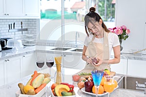 Cooking asian woman housewife in the kitchen making healthy food