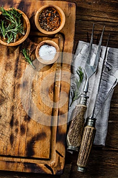 Cooking background concept. Vinrage cutting board with cutlery. Top view