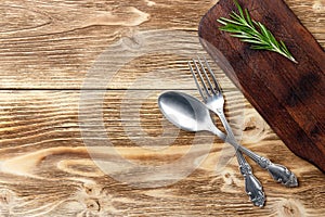 Cooking background concept. Vintage cutting board and cutlery. Top view.