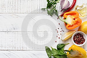 Cooking background. Fresh ingredients for eating vegetables, spices, herbs and olive oil gray concrete old background. Top view
