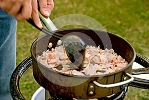 Cooking bacon outdoor