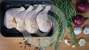 Cooking baked chicken. Prepare chicken marinated meat for the cooking in oven