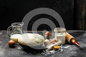 Cooking and baking ingredients utensils on dark background. Lactose and gluten free. place for text