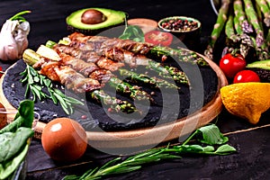 Cooking banner. Background with Grilled green asparagus wrapped with bacon. Food recipe