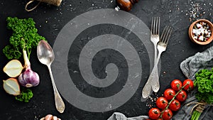 Cooking banner. Vegetables and spices on a black background.