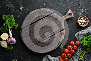 Cooking banner. Vegetables and spices on a black background.