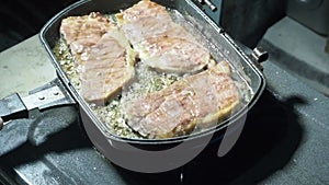 Cooking beef steak in a frying pan on the stove. Grilled steak.