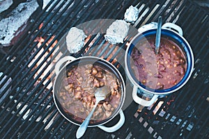 Cooking on bonfire: Tasty stew on a camping trip