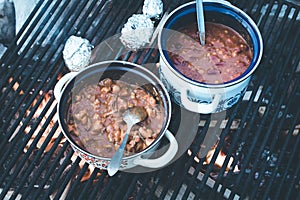 Cooking on bonfire: Tasty stew on a camping trip