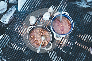 Cooking on bonfire: Tasty stew on a camping trip