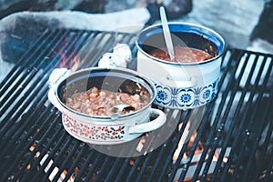 Cooking on bonfire: Tasty stew on a camping trip