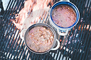 Cooking on bonfire: Tasty stew on a camping trip