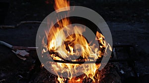 Cooking in a bucket on bonfire on night