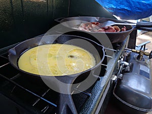 Cooking Camp Breakfast, Scrambled Eggs and Bacon