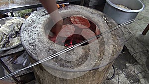 Cooking chapati in street market, India