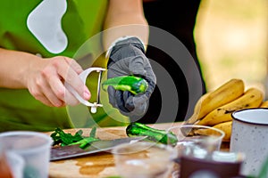 Cooking, Chef Cutting cucumber on hardboard and healthy food, Cutting cucumber slices on board with a sharp knife close