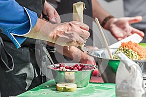 Cooking. Chef is cutting greens in the kitchen