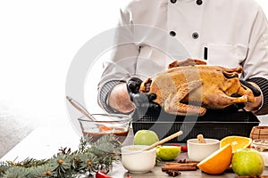 Cooking by chef - duck with oranges and apples, herbs and other ingred