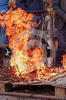 Cooking chestnuts on burning coals