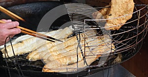 Cooking Chinese deep-fried dough stick also called youtiao