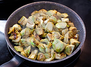 Cooking chopped artichokes on frypan