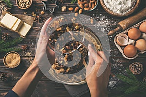 Cooking christmas fruit cake. Wooden table with baking ingredie