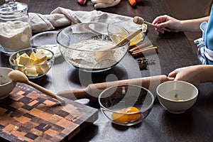 Cooking Christmas gingerbread cookies on a dark background.