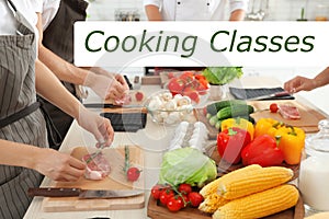 Cooking classes. Female chef preparing meat on board at table, closeup