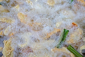 Cooking Concept Deep-fried fresh banana for Thai snack The banana is sliced into pieces and then fried with hot oil in a big iron