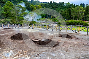 Cooking of Cozido Das Furnas meal, Sao Miguel, Azores. Hole in the ground for cooking Cozido das Furnas, a meat stew cooked by the photo