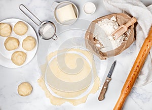 Cooking delicious crispy baked round puff pastry layers of homemade cakes on the table - dough