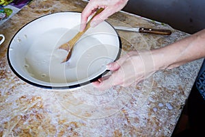 Cooking dough for a pie in the kitchen