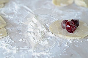 Cooking dumplings with cherries.