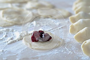 Cooking dumplings with cherries.