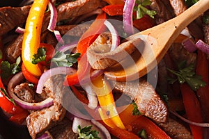 Cooking fajitas: beef with vegetables. macro horizontal photo