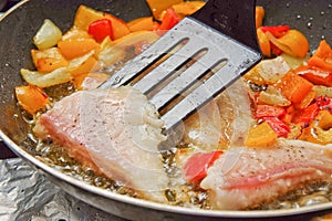 Cooking Fish and peppers