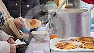 Cooking flatbread on the street to feed the homeless refugees