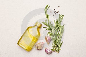 Cooking food background. Fresh rosemary, garlic clove, olive oil, black pepper