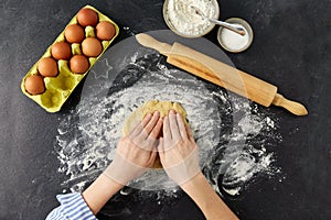 Hands making shortcrust pastry dough on table photo