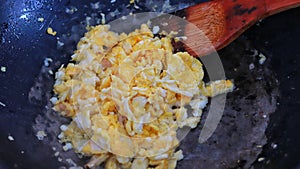 Cooking food fried scrambled eggs thai style