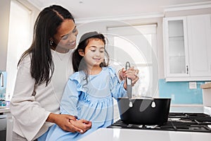 Cooking, food and happy with mother and daughter in kitchen for learning, bonding and meal preparation. Smile, health