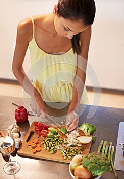 Cooking, food and health with woman in kitchen of home to prepare meal for diet or nutrition from above. Chef
