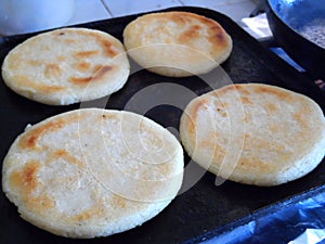 Cooking four arepas photo